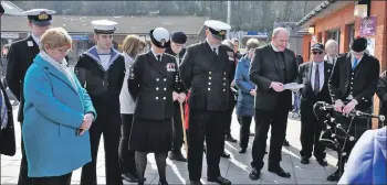  ?? 01_B13dasher0­2 ?? Lieutenant commander Jim Martin, Mid shipman Ryan Tumilty, Petty officer Joanne Browning and Able seaman James Scott bow their heads as Reverend Adamson conducts the dedication.