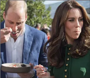  ??  ?? Ready for anything: William and Kate brave the traditiona­l clam dish