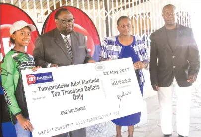  ??  ?? FOR A GOOD CAUSE . . . Tanya Muzinda (left), who is set to tour the United Kingdom this weekend, receives a cheque for $10 000 from CBZ Holdings group marketing and corporate affairs manager Laura Gwatiringa (second from right) in the presence of the...