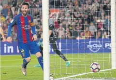  ?? REUTERS ?? Barcelona’s Lionel Messi scores a goal against Real Sociedad.