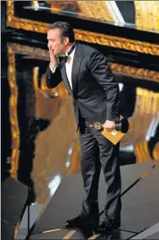  ??  ?? His night: Jean Dujardin wins the best-actor trophy for his role as a silent-film star threatened by talkies in The Artist. “I love your country!” Dujardin exclaims.