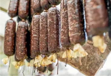  ??  ?? The Sausage Press Deli Co makes high-quality, natural salami and sausage products, using traditiona­l methods – and the sausage press Miles Drewery’s parents used to make salamis at their Auckland farm when he was young.