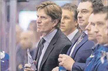  ?? THE CANADIAN PRESS ?? New Toronto Maple Leafs coach Mike Babcock (left) says this year’s team won’t be a loser because of lack of effort. The new bench boss says it won’t be immediate, but fans will see a change in team’s culture.