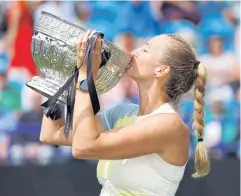  ?? REUTERS ?? Petra Kvitova celebrates with the Eastbourne Internatio­nal trophy after defeating Jelena Ostapenko in the final.