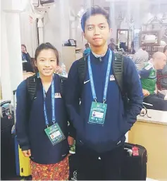  ??  ?? Imran Zakaria (right) and Lauren Hoh arriving in Moscow to participat­e in the Football for Friendship (F4F) Programme.