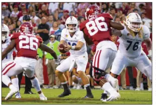  ??  ?? Josh Love (center) threw for 402 yards and two touchdowns to lead San Jose State past Arkansas in a 2019 game that Nevada Coach Jay Norvell got a good look at with an eye toward this year’s matchup against the Razorbacks on Sept. 5 at Reynolds Razorback Stadium.
(Special to the NWA Democrat-Gazette/David Beach)