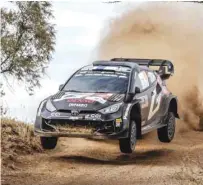  ?? (AFP) ?? Toyota Gazoo Racing WRT’s Finnish driver Kalle Rovanpera steers his Toyota GR Yaris Rally1 Hybrid with Finnish co-driver Jonne Halttunen during the World Rally Championsh­ip Safari Rally Kenya Special Stage 8 in Gilgil, Kenya, yesterday.