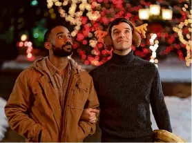  ?? Philippe Bosse/Netflix ?? Philemon Chambers as Nick, left, and Michael Urie as Peter, in the festive rom-com “Single All The Way” on Netflix.