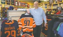  ?? LARRY WONG ?? There has been a huge increase in Oilers merchandis­e sales this year, according to Jack Cookson at Pro Am Sports in Edmonton.