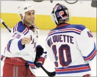  ?? John Amis / Associated Press ?? The New York Rangers’ Scott Gomez, left, celebrates with goalie Steve Valiquette after they beat the Atlanta Thrashers 3-2 in overtime in 2008.