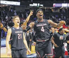  ?? KEVIN C. COX / GETTY IMAGES ?? South Carolina’s Rakym Felder (4) and his teammates should have plenty of confidence after shocking Duke 88-81 on Sunday in Greenville, S.C. The Gamecocks face Baylor on Friday in the Sweet 16.