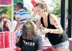  ?? STANDARD FILE PHOTO ?? A girl gets her face painted at last year’s Facer Fest.