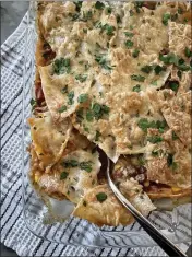  ?? ?? Mexican `lasagna' with turkey, corn and pinto beans combines the flavors people love in Mexican cuisine with the layered format of lasagna.