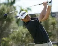  ?? MARCO GARCIA — THE ASSOCIATED PRESS ?? Patton Kizzire follows his drive off the first tee box during the final round of the Sony Open, Sunday in Honolulu.