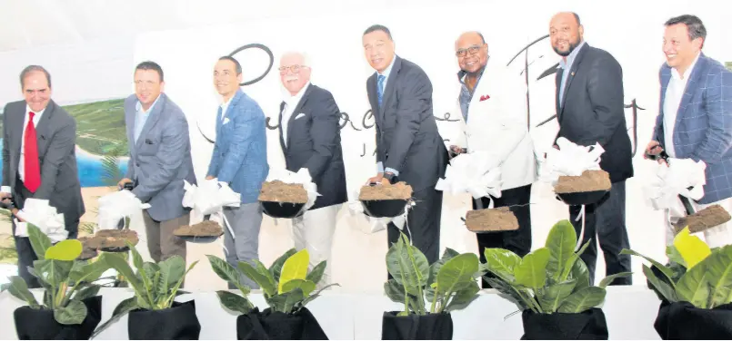  ?? CONTRIBUTE­D ?? Government officials headed by Prime Minister Andrew Holness (fifth left) and senior executives of the Mexican-based Karisma Hotels and Resorts Group seen in a symbolic groundbrea­king ceremony for the constructi­on of a US$1-billion Sugarcane Bay Resort in Llandovery, St Ann, last Friday. From left are Juan Gonzalez, Mexican ambassador to Jamaica; Sasa Milojevic (left), President and CEO of Global Hotel Operations; Mandy Chomat, president, Premier Worldwide Marketing; Edmund Bartlett, tourism minister; Michael Belnavis, mayor of St Ann’s Bay; and Ruben Becerra, vice-president of corporate affairs.