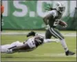  ?? SETH WENIG - THE ASSOCIATED PRESS ?? New York Jets’ Isaiah Crowell (20) runs away from Denver Broncos’ Shaquil Barrett (48) during the second half of an NFL football game Sunday, Oct. 7, 2018, in East Rutherford, N.J.