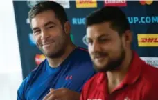  ?? BERTRAND LANGLOIS/AFP/GETTY IMAGES ?? Canada’s lock Jamie Cudmore and Benoit Piffero speak with the media ahead of Thursday’s Rugby World Cup match against France.