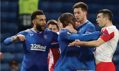  ??  ?? Rangers’ Finnish midfielder Glen Kamara (centre) and Slavia Prague’s Czech defender Ondrej Kudela (right) clash during a Europa League last-16 game. Photograph: Andrew Milligan/AFP/Getty Images