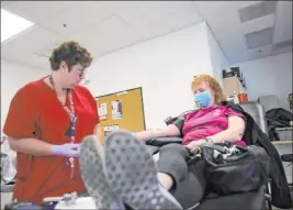  ?? Michael Quine Las Vegas Review-journal @Vegas88s ?? Eva Clappa, left, takes a blood donation from Susan Edwards in March. American Red Cross blood drives will be held across the valley this month.