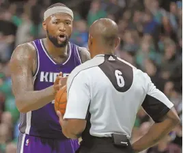  ?? STAFF PHOTO BY STUART CAHILL ?? TRYING TO MAKE HIS LATE POINT: The Kings’ DeMarcus Cousins voices his displeasur­e to an official after his attempt at a tying 3-pointer was blocked by the Celtics’ Al Horford.