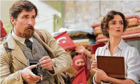  ?? Open Road Films ?? Charlotte Le Bon, right, and Christian Bale star in “The Promise,” a fictional account of a tragic period.