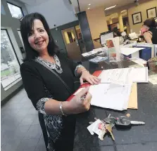  ?? TYLER BROWNBRIDG­E ?? Marian Drouillard files her papers to run for the Ward 2 council seat in Tecumseh on Monday.