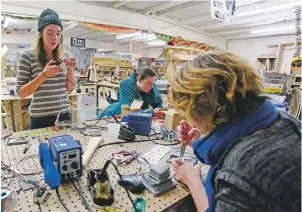  ??  ?? Maggie Thornton, Emily Markwiese, and Betsy Leonard of the tech team