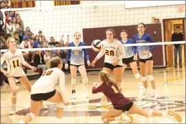  ?? Photo by Becky Polaski ?? Gabby Weisner, 4, makes a diving play to keep the ball from hitting the ground during the third set of ECC’s match against Johnsonbur­g on Thursday.