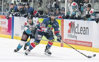  ?? Picture: Derek Black. ?? Stars Fab Ricci shields the puck from Giants Josh Roach on Saturday.