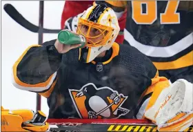  ?? GENE J. PUSKAR - THE ASSOCIATED PRESS ?? Pittsburgh Penguins goaltender Casey DeSmith drinks during the third period of an NHL hockey game against the Columbus Blue Jackets in Pittsburgh, Friday, April 29, 2022.