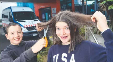  ?? Picture: GLENN FERGUSON ?? Luke Blackley and Amber Towart have gone the chop to raise money for the Andrew Love Cancer Centre.