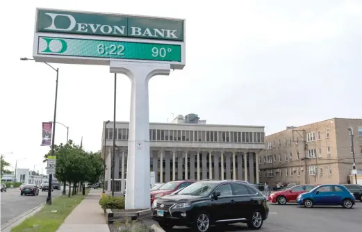  ?? TYLER LARIVIERE/SUN-TIMES ?? David Loundy, the chairman and CEO of Devon Bank, said the PPP loans “helped a lot of people. Period, full stop.” The bank headquarte­red at 6445 N. Western Ave., shown here, processed PPP loans.