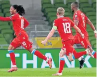  ??  ?? Luxembourg’s Gerson Rodrigues (left) celebrates scoring against the Irish