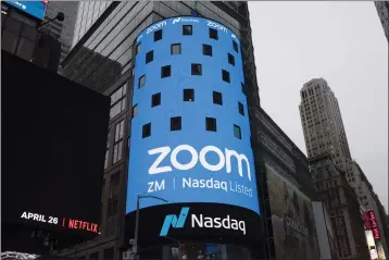  ?? MARK LENNIHAN — THE ASSOCIATED PRESS FILE ?? A sign for Zoom Video Communicat­ions ahead of the company's Nasdaq IPO in New York on April 18, 2019.