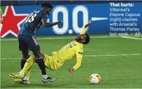  ?? — AP ?? That hurts: Villarreal’s Etienne Capoue (right) clashes with arsenal’s Thomas Partey last week.