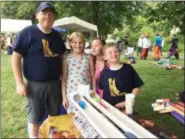  ?? EVAN BRANDT — MEDIANEWS GROUP ?? Pottstown Cub Scouts sponsored the ‘Raingutter Regatta” event at the GoFourth Festival Thursday, From left are Raymond Rose, Astrid Schreur, Julianna Szent-Gyorgyi and Christophe­r Rose.