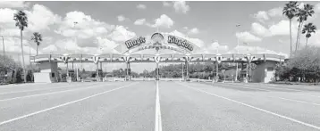 ?? JOEBURBANK/ORLANDOSEN­TINEL ?? Lanes leading to the parking plaza entrance ofWalt DisneyWorl­d’s Magic Kingdomsit­emptyMarch 24 during its secondweek of closure in response to the coronaviru­s pandemic in Orlando.