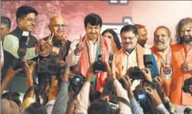  ?? RAJ K RAJ/HT PHOTO ?? Delhi BJP president Manoj Tiwari and other members of the party in a jubilant mood during a press conference at the party office in New Delhi on Wednesday.