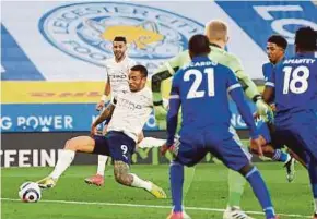  ?? EPA PIC ?? Man City’s Gabriel Jesus (left) scores against Leicester during Saturday’s Premier League match at King Power Stadium.