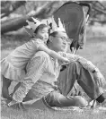  ??  ?? Julia Kim, 3, and her dad Young Kim enjoyed the family garden party.