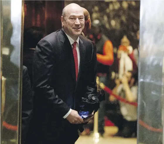  ?? EVAN VUCCI / THE ASSOCIATED PRESS ?? Goldman Sachs president Gary Cohn gets on an elevator for a meeting with U.S. president-elect Donald Trump last month in New York.