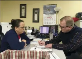  ?? ADAM BEAM — THE ASSOCIATED PRESS ?? David Ermold, right, files to run for Rowan County Clerk in Kentucky as Clerk Kim Davis looks on Wednesday in Morehead, Ky. Davis denied Ermold and his husband a marriage license two years ago because she was opposed to gay marriage for religious...