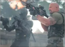  ??  ?? Ray Park (left) and Dwayne Johnson fire in “G.I. Joe: Retaliatio­n.”