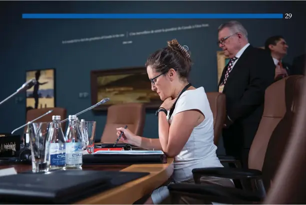  ?? Adam Scotti photo ?? Chrystia Freeland, then internatio­nal trade minister, reviews her notes prior to the North American Leaders’ Summit in Ottawa, June 29, 2016. Public Safety Minister Ralph Goodale looks on.