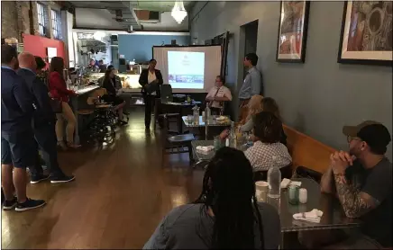  ?? RICHARD PAYERCHIN — THE MORNING JOURNAL ?? Nathasha Cresap, economic developmen­t specialist for Lorain County Community Developmen­t Department, speaks at the Mix & Mingle event hosted by Main Street Lorain on Oct. 5at Union Town Provisions.