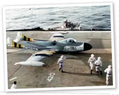  ??  ?? A flak damaged
Sea Venom of 893 Naval Air Squadron in distinctiv­e campaign markings, returns to HMS Eagle following a sortie over Egyptian targets on 4 November 1956