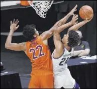  ?? Jessica Hill The Associated Press ?? Villanova forward Jeremiah Robinson-Earl tries to shoot against Virginia Tech forward Keve Aluma in the first half of the Hokies’ 81-73 overtime win Saturday at Mohegan Sun Arena.