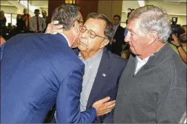  ?? CONTRIBUTE­D BY STEPHEN SPILLMAN ?? Chris Del Conte (left) greets his mentor, Jim Livengood (center), and former Texas AD DeLoss Dodds at Monday’s press conference.