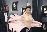  ?? PHOTO: REUTERS ?? Entrancing . . . Offset and Cardi B arrive at the Grammy Awards yesterday.