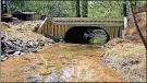  ?? Contribute­d ?? An example of the way the Nature Conservanc­y has helped fish passage by removing an old culvert and replacing it with a bottomless culvert on Rock Creek.